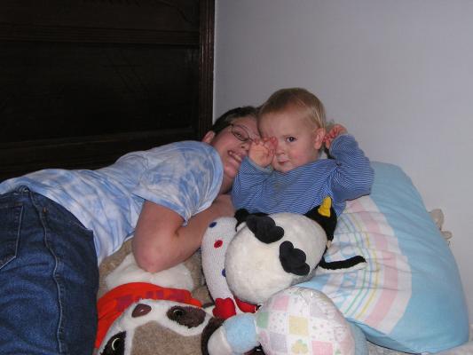 Joe tries to burry Noah in stuffed animals.