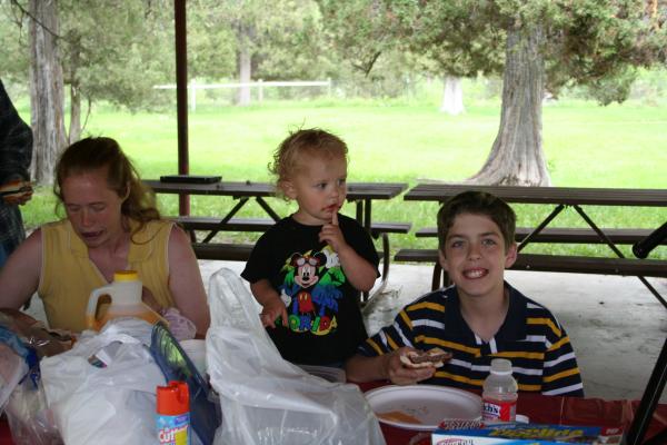 Katie, Noah and Michael eat hamburgers.