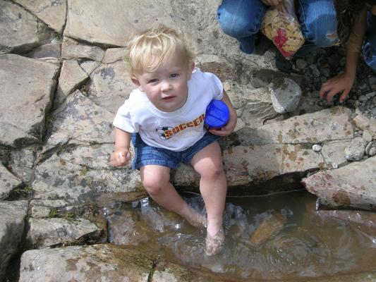 Noah participates in a feet washing ceremony.