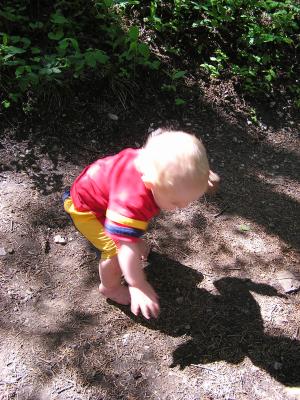 Noah tries to pick up his shadow.