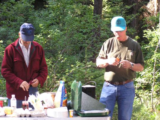 Tom and John preparing some food.
