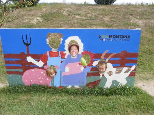 Sarah (pig), Katie (farmer's wife), and Noah (goat)