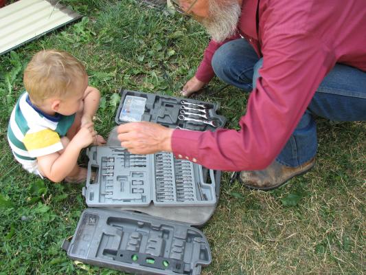 Noah plays with grandpa's tools