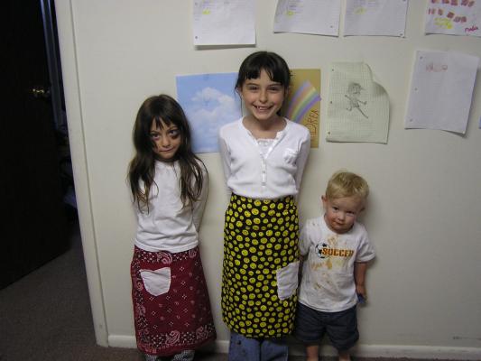 Malia and Andrea wear their new aprons.