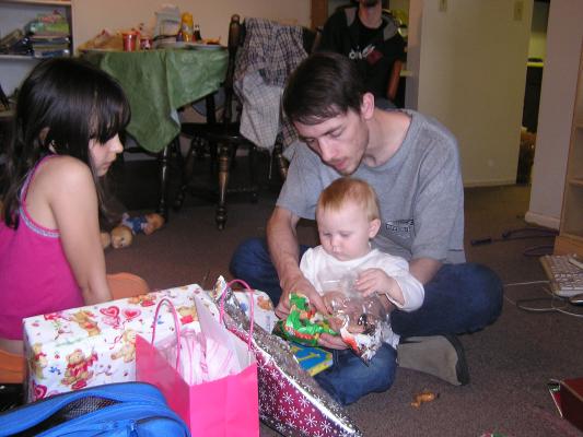 Sarah and David open presents.