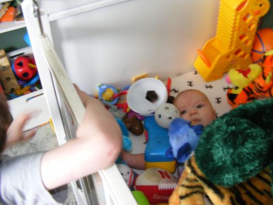 Noah got all the baby toys for Joshua to play with.