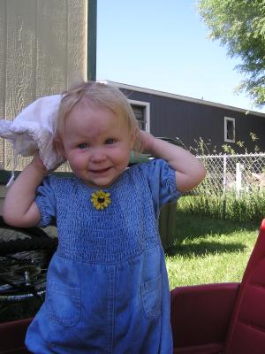 Sarah plays with a hat