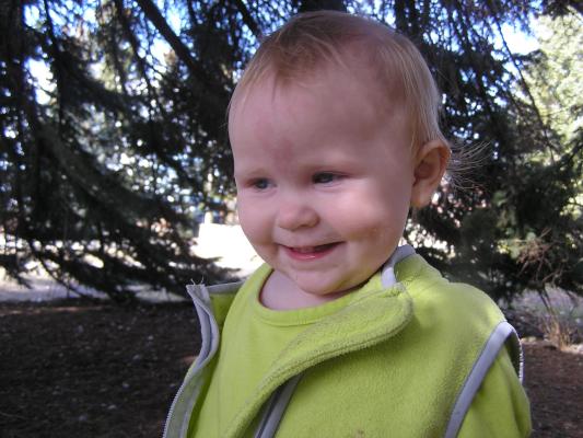 Sarah is happy to be at the MSU duck pond on a sunny St. Patty's Day.