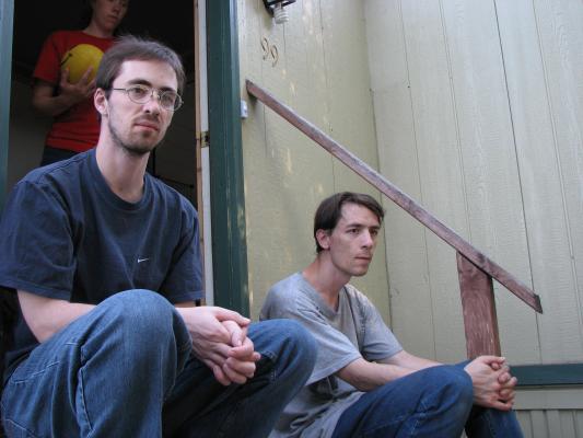 Jim and David sitting on the steps. They look excited.