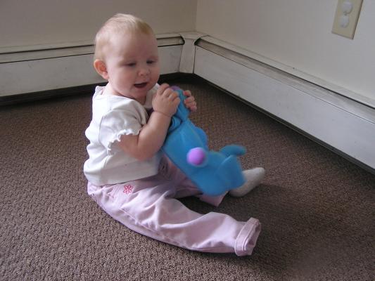 Sarah plays with her new elephant.