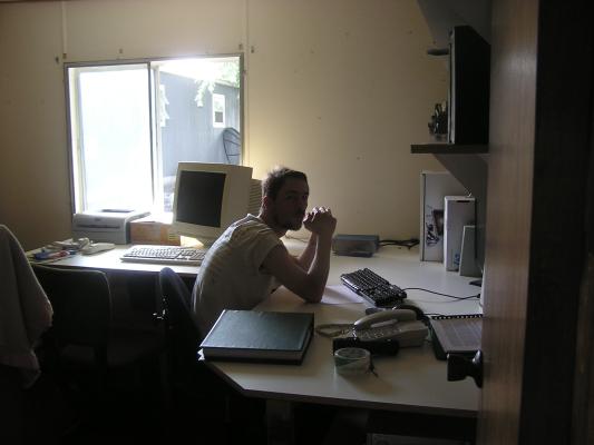 David at the new desk he made.