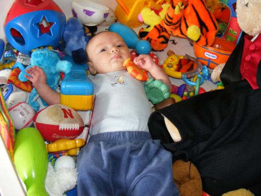 Noah got all the baby toys for Joshua to play with.