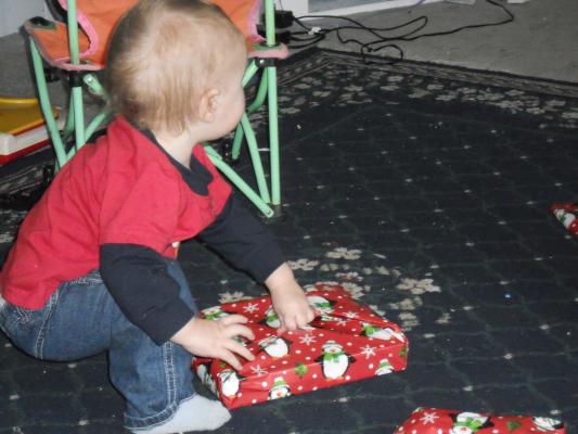 Opening gifts from Mom and Dad on his birthday. 