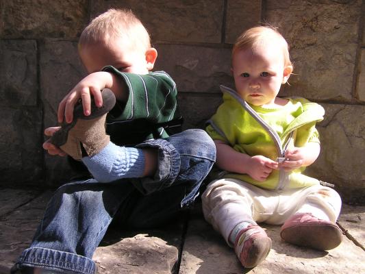Noah and Sarah by a rock wall at MSU.