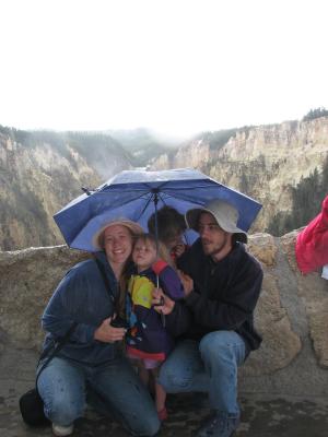 Katie, Sarah Noah and David under an umbrella