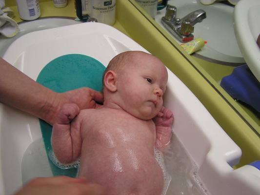 Sarah takes a bath.