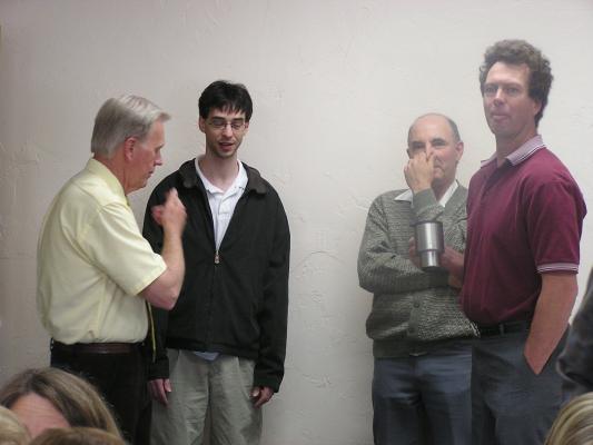 The guys stand around and talk.