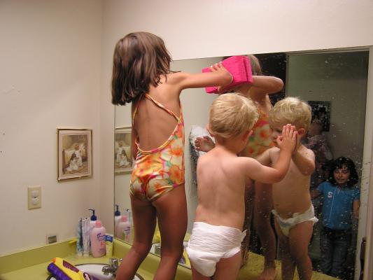 Andrea and Noah wash the mirror.