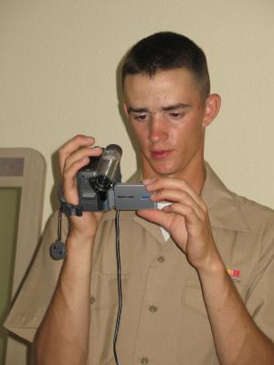 Matthew plays with a video camera.