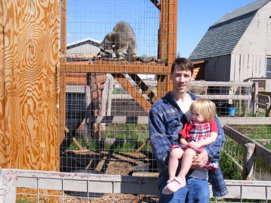 David and Sarah pose by a racoon at the Beartooth Nature Center.