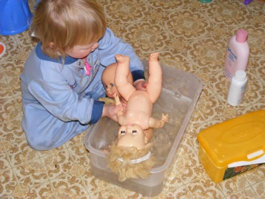 Sarah gives some babies a bath