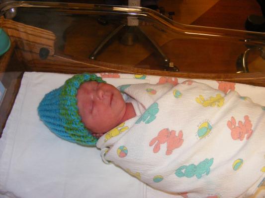 All wrapped up, showing off the new hat.