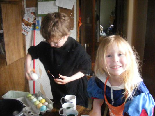 Sarah smiling while dying eggs.