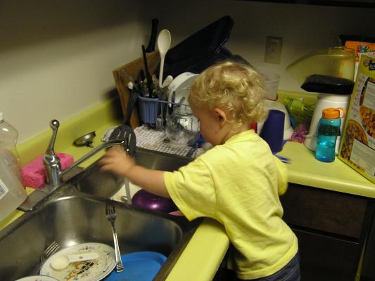 Noah washing dishes.