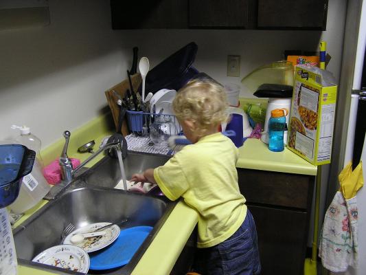 Noah washing dishes.