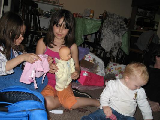 Andrea and Malia play with Sarah's baby.