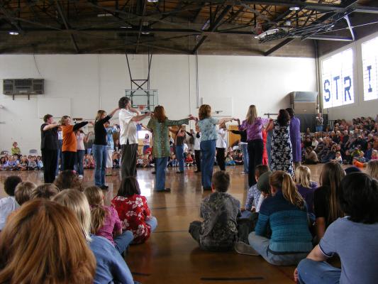 The teachers dance too.