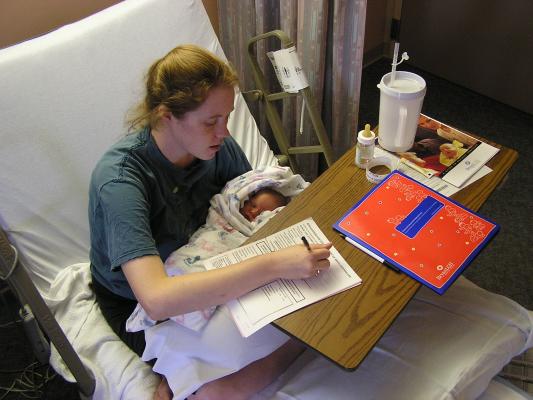 Katie fills out paperwork to go home