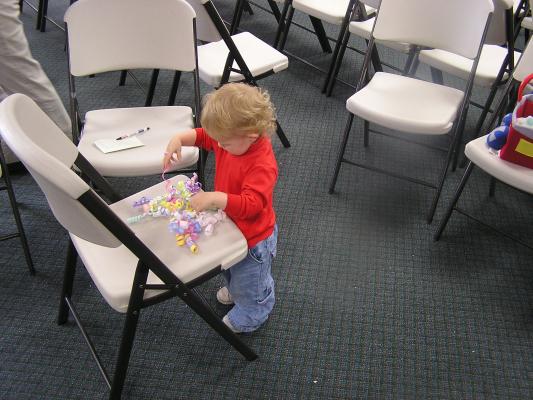 Noah plays with some of the ribbons.
