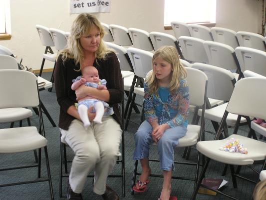 Myra and Amie take care of Sarah.