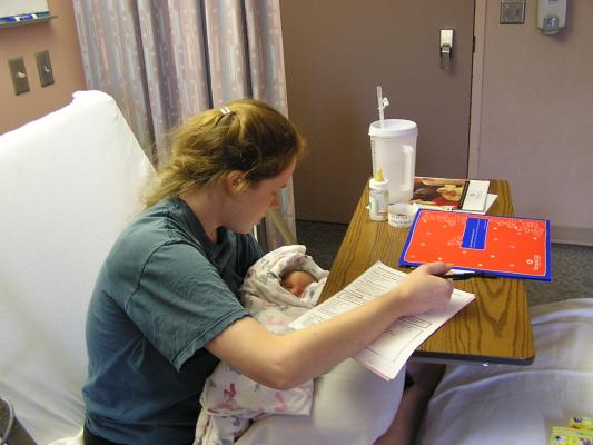 Katie fills out paperwork to go home