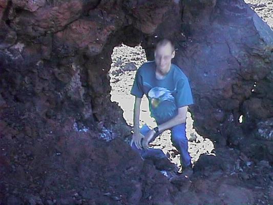 Dale peeks through the rocks