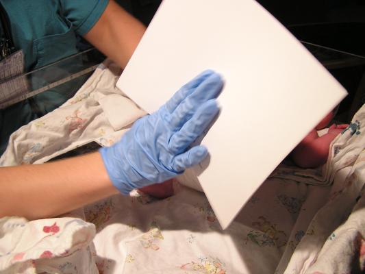 Noah gets hist foot prints stamped