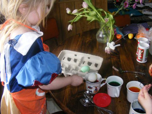 Sarah (as snow white) dying eggs.