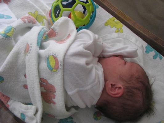 Joshua in his little hospital crib.
