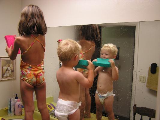 Andrea and Noah wash the mirror.