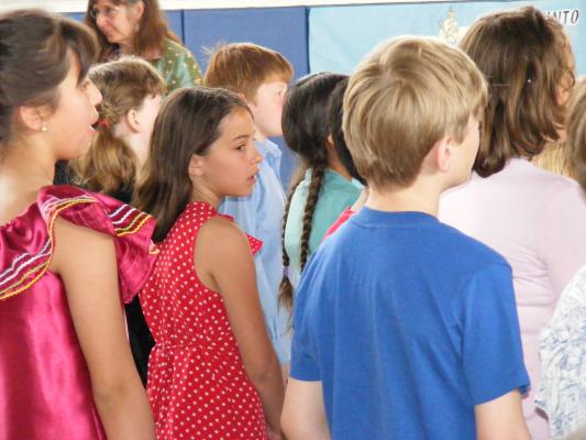Malia singing with her class at Irving School's International Day.
