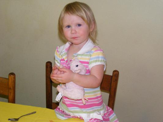 Sarah feeds her baby pig