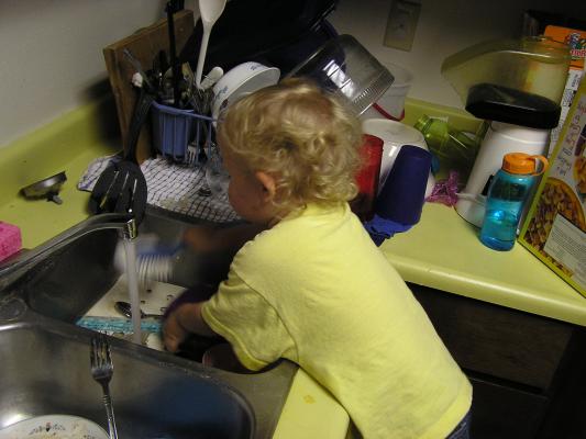 Noah washing dishes.