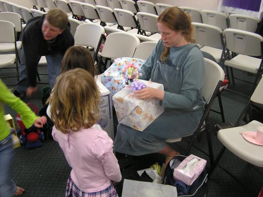 Katie opens presents at Sarah baby shower.