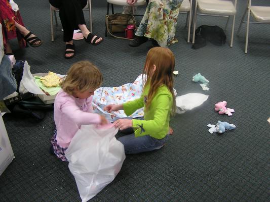 The kids help pick up the trash.